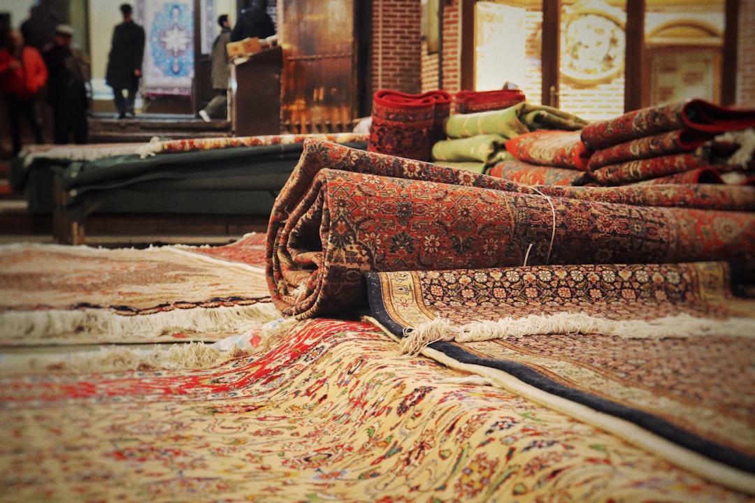 a-pile-of-rugs-sitting-on-top-of-a-floor-vkcmm43eftc